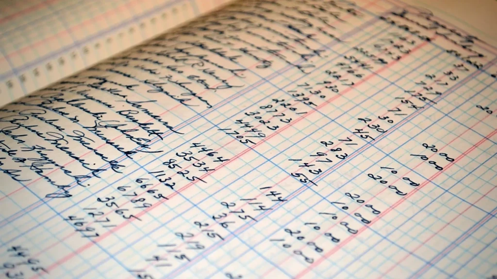 Registre comptable manuscrit, colonnes réglées
